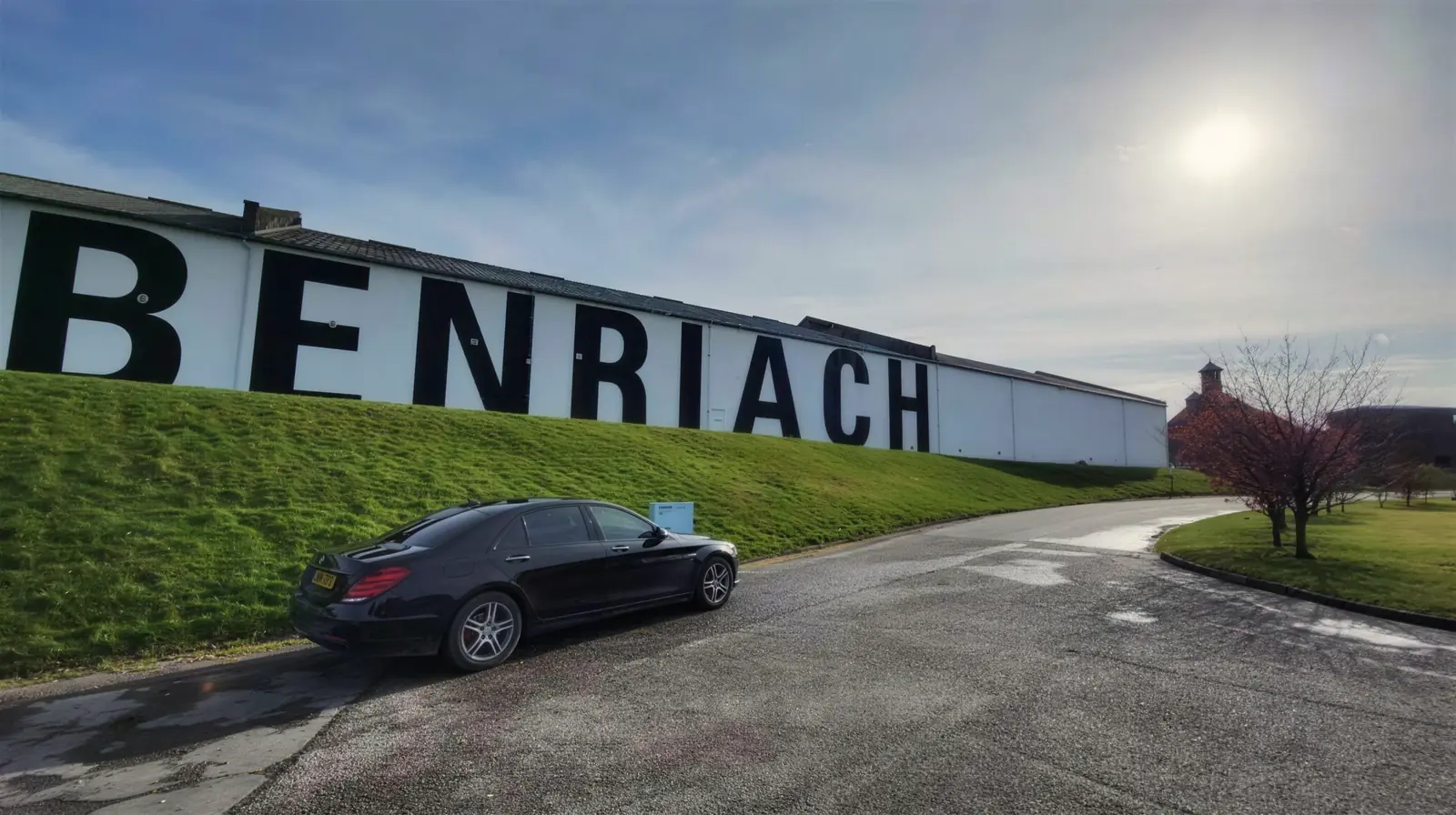 Mercedes S-Class beneath the BenRiach Distillery lettering