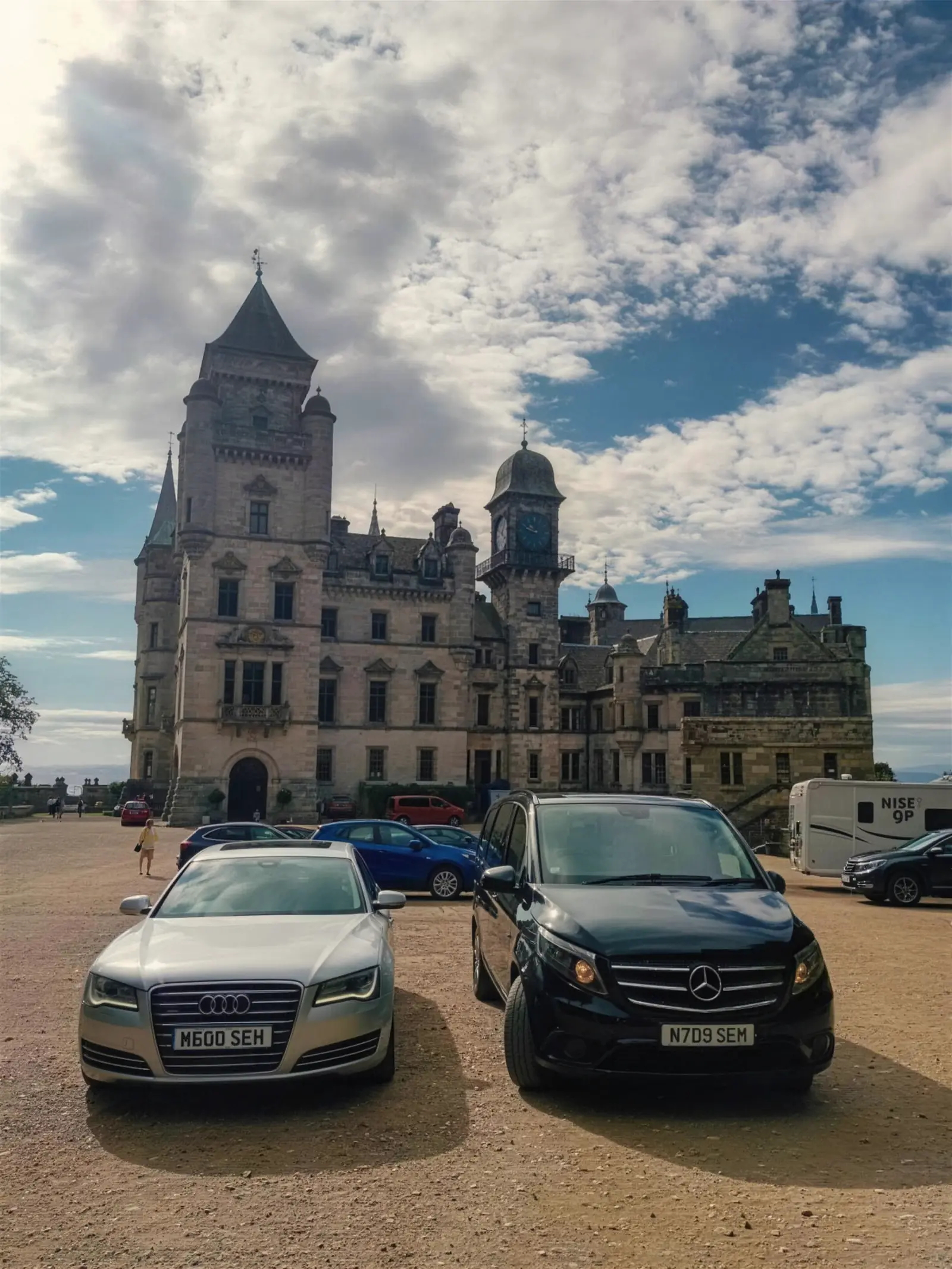 Audi A8 L and Vito in front of a turreted Highland castle